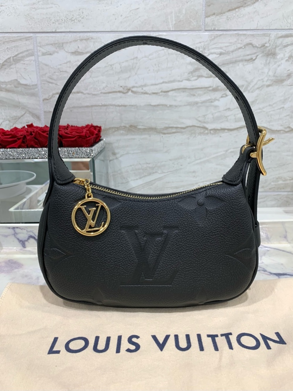 Authentic LOUIS VUITTON Empreinte Monogram Mini Moon in Black